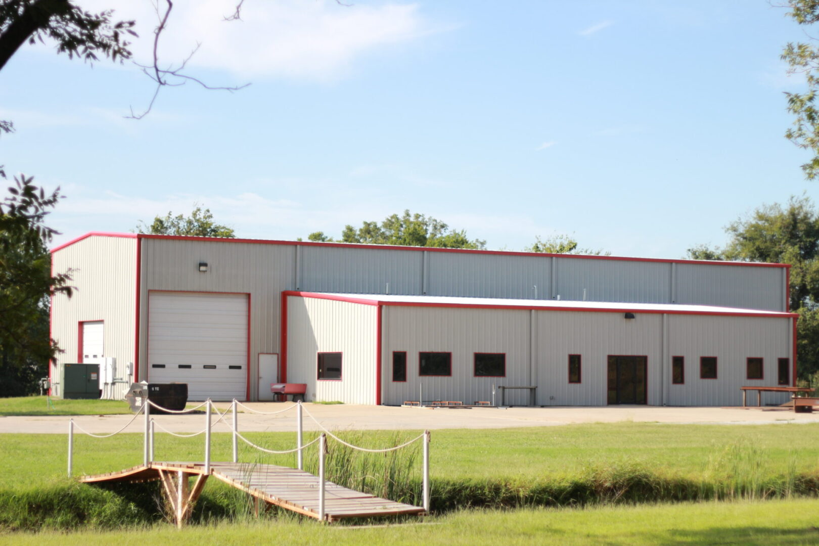 a warehouse with a bridge in front